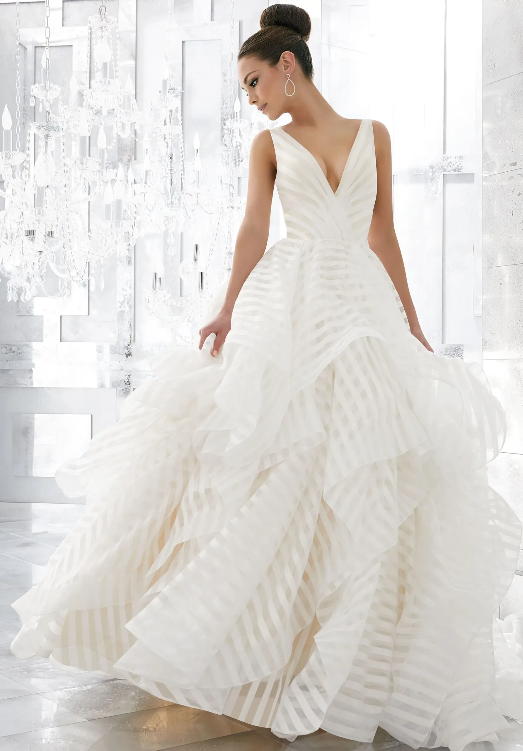 model is wearing a sleeveless a-line wedding dress