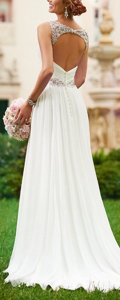 Youll look classic and divine in this sheath Chiffon wedding dress. This wedding gown highlights fine Diamante detailing on its waist, shoulder straps, and in the keyhole head-turning back. The back zips up supporting sparkling crystal buttons and the adapted bodice boasts soft ruching. Its the perfect wedding dress you need for a little price and a great look! http://www.cutedresses.co/product/v-neck-shoulder-straps-soft-ruching-chiffon-wedding-gown/: 