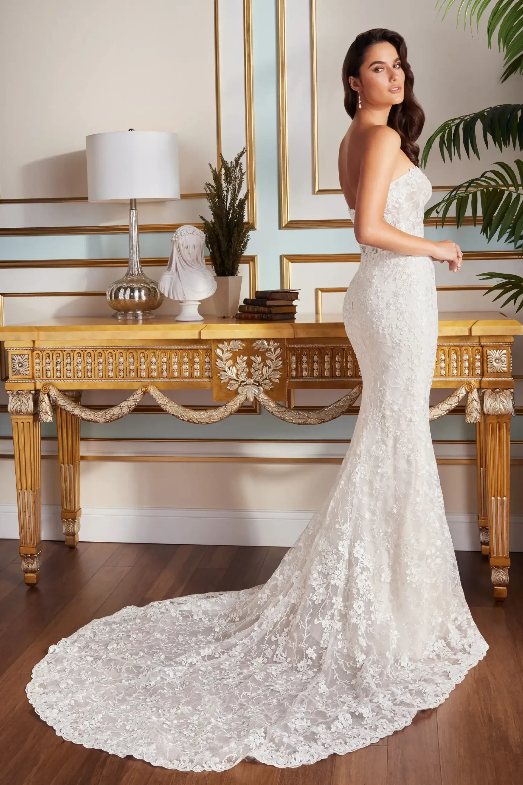 model is wearing a fit and flare bridal gown 