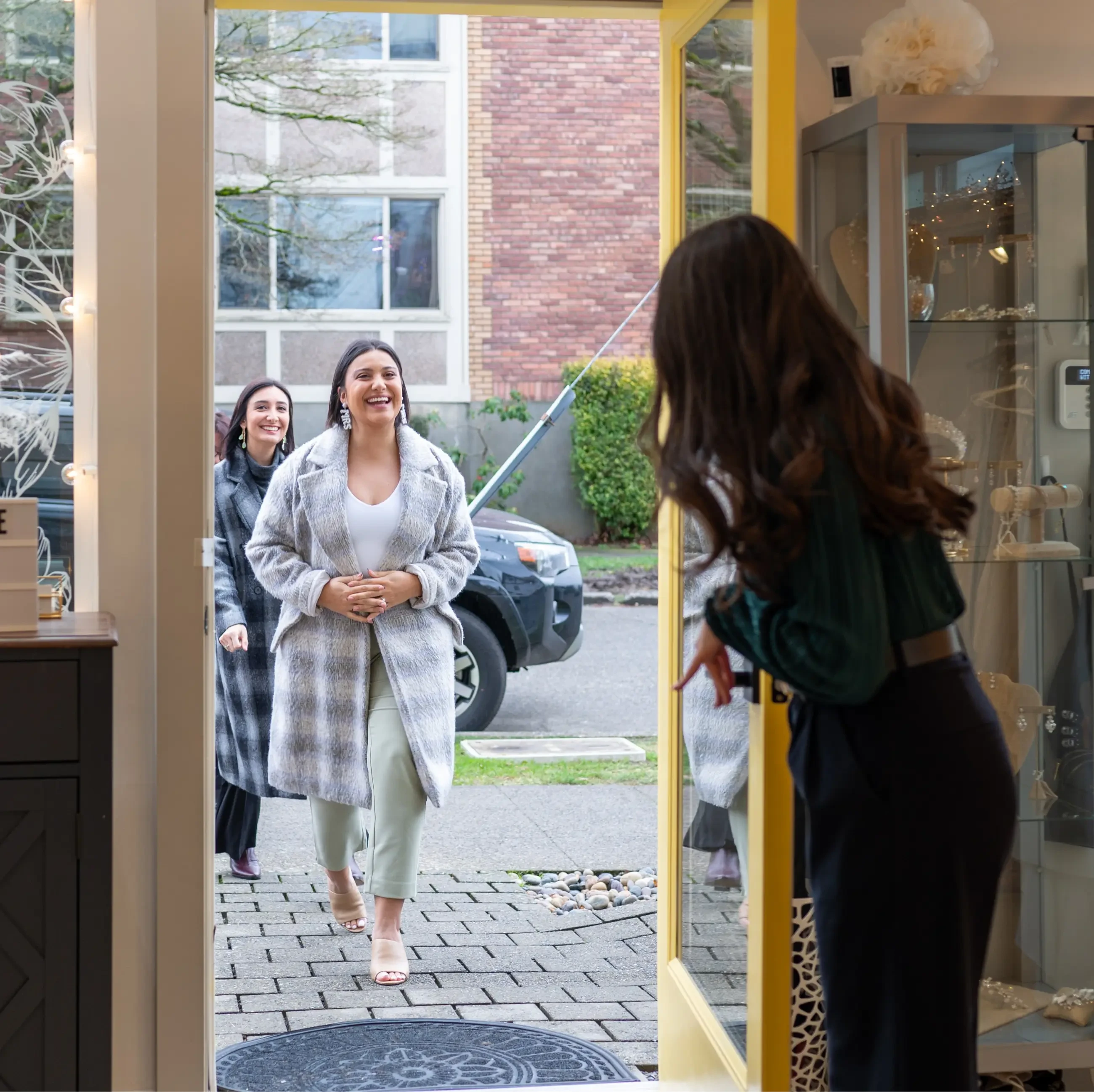 photo of bride entering bridal shop Photo by  Seattle Ink and Paper Photo