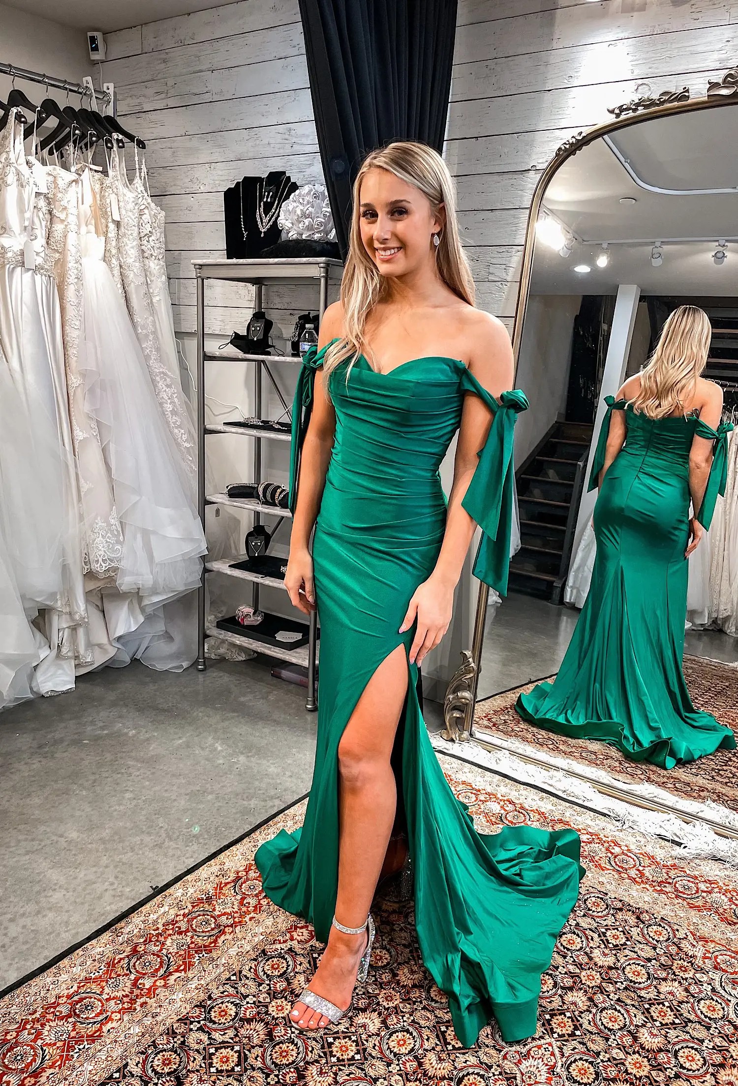 Model wearing a green evening gown